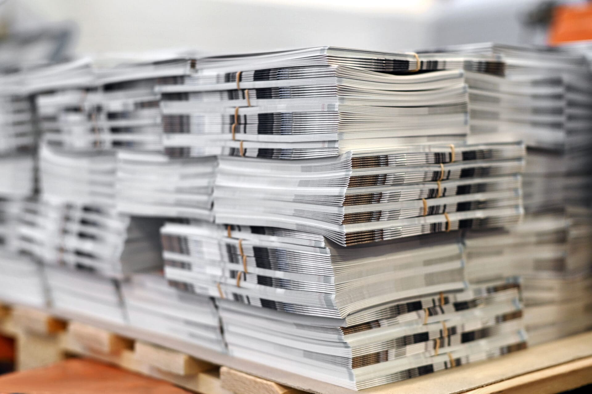 A stack of magazines on top of each other.