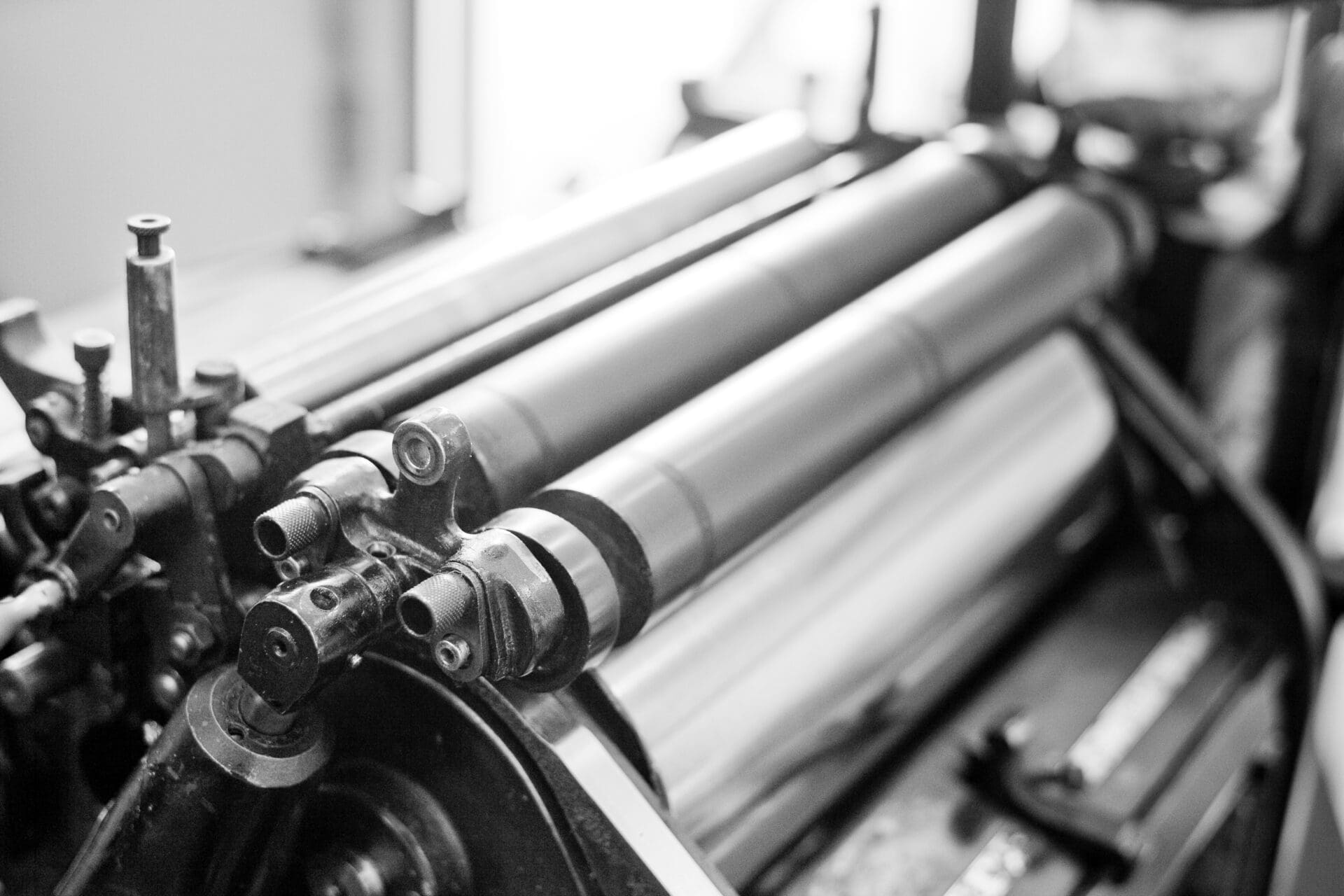 A black and white photo of some rolls of paper